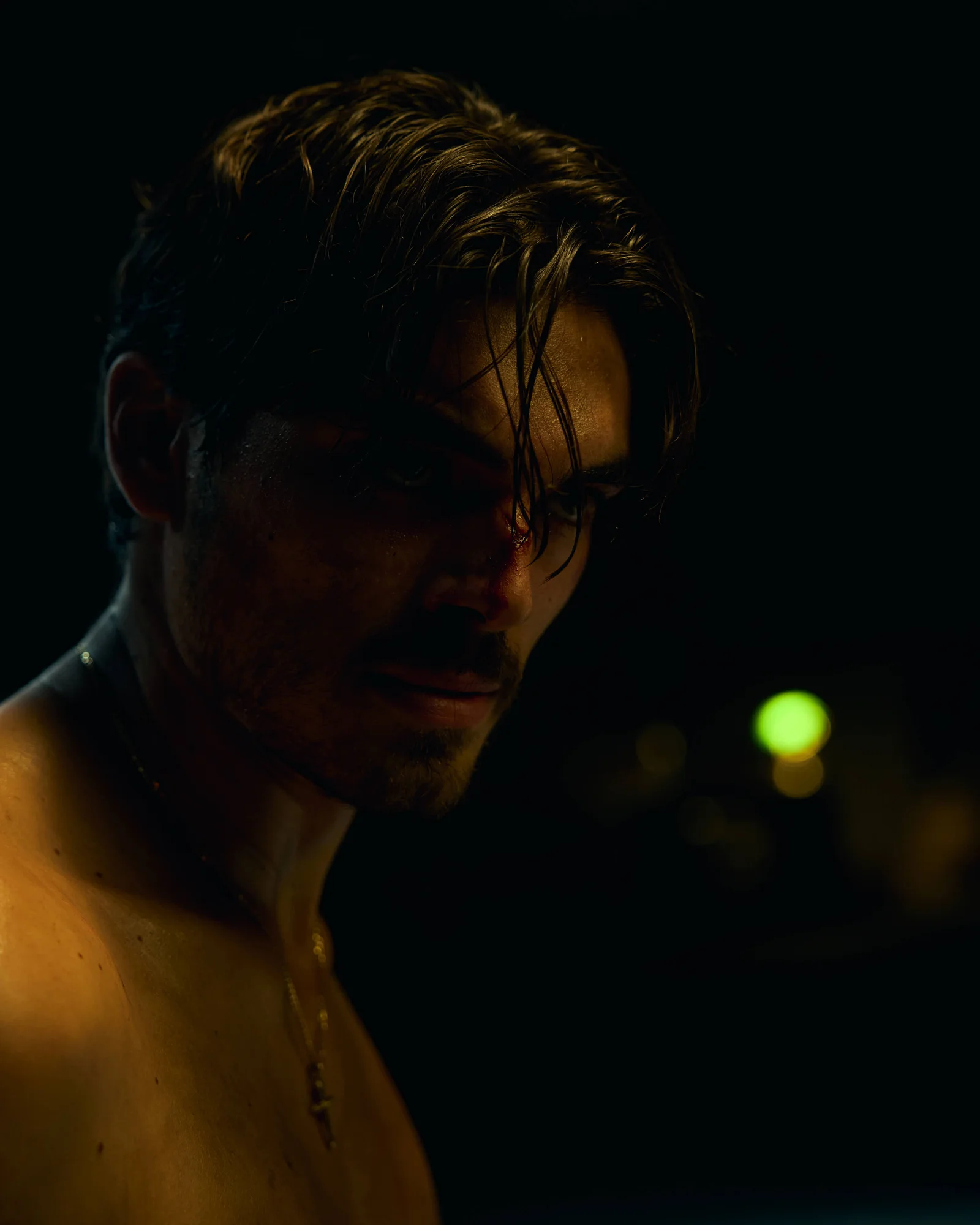 Close portrait of an actor with stage blood during production. The Hitman’s Dalliance.